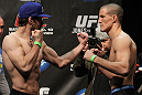 TORONTO, ON - DECEMBER 09:  (L-R)  Opponents Mitch Clarke and John Cholish face off after weighing in during the UFC 140 Official Weigh-in at the Air Canada Centre on December 9, 2011 in Toronto, Canada.  (Photo by Josh Hedges/Zuffa LLC/Zuffa LLC via Getty Images)