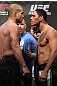 TORONTO, ON - DECEMBER 09:  (L-R) Light Heavyweight opponents Tito Ortiz and Antonio Rogerio "Minotoro" Nogueira face off after weighing in during the UFC 140 Official Weigh-in at the Air Canada Centre on December 9, 2011 in Toronto, Canada.  (Photo by Josh Hedges/Zuffa LLC/Zuffa LLC via Getty Images)
