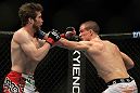 TORONTO, ON - DECEMBER 10:  (R-L) John Cholish punches Mitch Clarke during the UFC 140 event at Air Canada Centre on December 10, 2011 in Toronto, Ontario, Canada.  (Photo by Josh Hedges/Zuffa LLC/Zuffa LLC via Getty Images)