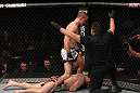 TORONTO, ON - DECEMBER 10:  (R-L) Referee John McCarthy stops the bout as John Cholish (standing) defeats Mitch Clarke by TKO during the UFC 140 event at Air Canada Centre on December 10, 2011 in Toronto, Canada.  (Photo by Nick Laham/Zuffa LLC/Zuffa LLC)