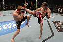 TORONTO, ON - DECEMBER 10:  (R-L) Nik Lentz kicks Mark Bocek during the UFC 140 event at Air Canada Centre on December 10, 2011 in Toronto, Ontario, Canada.  (Photo by Nick Laham/Zuffa LLC/Zuffa LLC via Getty Images)