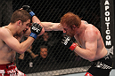 TORONTO, ON - DECEMBER 10:  (R-L) Mark Bocek punches Nik Lentz during the UFC 140 event at Air Canada Centre on December 10, 2011 in Toronto, Ontario, Canada.  (Photo by Nick Laham/Zuffa LLC/Zuffa LLC via Getty Images)