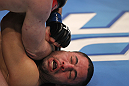 TORONTO, ON - DECEMBER 10:  John Makdessi absorbs an elbow strike from Dennis Hallman during the UFC 140 event at Air Canada Centre on December 10, 2011 in Toronto, Ontario, Canada.  (Photo by Nick Laham/Zuffa LLC/Zuffa LLC via Getty Images)
