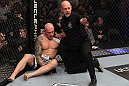 TORONTO, ON - DECEMBER 10:  (R-L) Referee Yves Lavigne calls for a doctor after Krzysztof Soszynski was knocked out by Igor Pokrajac during the UFC 140 event at Air Canada Centre on December 10, 2011 in Toronto, Ontario, Canada.  (Photo by Nick Laham/Zuffa LLC/Zuffa LLC via Getty Images)