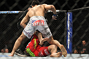 TORONTO, ON - DECEMBER 10:  "The Korean Zombie" Chan Sung Jung (white shorts) defeats Mark Hominick by knockout during the UFC 140 event at Air Canada Centre on December 10, 2011 in Toronto, Ontario, Canada.  (Photo by Josh Hedges/Zuffa LLC/Zuffa LLC via Getty Images)