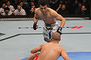 TORONTO, ON - DECEMBER 10:  (L-R) "The Korean Zombie" Chan Sung Jung rushes in to finish Mark Hominick after knocking him down with a punch during the UFC 140 event at Air Canada Centre on December 10, 2011 in Toronto, Ontario, Canada.  (Photo by Nick Laham/Zuffa LLC/Zuffa LLC via Getty Images)