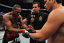 TORONTO, ON - DECEMBER 10:  (L-R) Light Heavyweight Champion Jon Jones and challenger Lyoto Machida receive final instructions from referee John McCarthy before their bout. (Photo by Nick Laham/Zuffa LLC/Zuffa LLC via Getty Images)