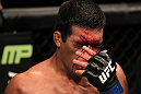 TORONTO, ON - DECEMBER 10:  Lyoto Machida wipes blood from his face during his bout agaisnt Jon Jones during the UFC 140 event at Air Canada Centre on December 10, 2011 in Toronto, Ontario, Canada.  (Photo by Nick Laham/Zuffa LLC/Zuffa LLC via Getty Images)
