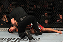 TORONTO, ON - DECEMBER 10:  Lyoto Machida lies on the canvas unconscious after being defeated by Jon "Bones" Jones during the UFC 140 event at Air Canada Centre on December 10, 2011 in Toronto, Ontario, Canada.  (Photo by Nick Laham/Zuffa LLC/Zuffa LLC via Getty Images)