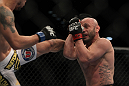 LAS VEGAS, NV - DECEMBER 30:  Manny Gamburyan (right) blocks a kick thrown by Diego Nunes (left) during the UFC 141 event at the MGM Grand Garden Arena on December 30, 2011 in Las Vegas, Nevada.  (Photo by Josh Hedges/Zuffa LLC/Zuffa LLC via Getty Images) *** Local Caption *** Manny Gamburyan; Diego Nues