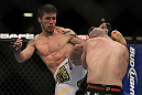 LAS VEGAS, NV - DECEMBER 30:  Diego Nunes (left) kicks Manny Gamburyan (right) during the UFC 141 event at the MGM Grand Garden Arena on December 30, 2011 in Las Vegas, Nevada.  (Photo by Josh Hedges/Zuffa LLC/Zuffa LLC via Getty Images) *** Local Caption *** Diego Nunes; Manny Gamburyan