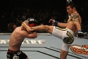 LAS VEGAS, NV - DECEMBER 30:  Diego Nunes (right) throws a headkick at Manny Gamburyan (left) during the UFC 141 event at the MGM Grand Garden Arena on December 30, 2011 in Las Vegas, Nevada.  (Photo by Donald Miralle/Zuffa LLC/Zuffa LLC via Getty Images) *** Local Caption *** Diego Nunes; Manny Gamburyan