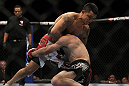 LAS VEGAS, NV - DECEMBER 30:  Efrain Escudero (white shorts) defends against a takedown from Jacob Volkmann (black shorts) during the UFC 141 event at the MGM Grand Garden Arena on December 30, 2011 in Las Vegas, Nevada.  (Photo by Josh Hedges/Zuffa LLC/Zuffa LLC via Getty Images) *** Local Caption *** Jacob Volkmann; Efrain Escudero