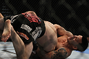 LAS VEGAS, NV - DECEMBER 30:  Efrain Escudero (right) attempts to submit Jacob Volkmann during the UFC 141 event at the MGM Grand Garden Arena on December 30, 2011 in Las Vegas, Nevada.  (Photo by Josh Hedges/Zuffa LLC/Zuffa LLC via Getty Images) *** Local Caption *** Efrain Escudero; Jacob Volkmann