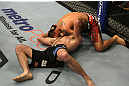 LAS VEGAS, NV - DECEMBER 30:  Efrain Escudero (top) attempts to choke out Jacob Volkmann during the UFC 141 event at the MGM Grand Garden Arena on December 30, 2011 in Las Vegas, Nevada.  (Photo by Donald Miralle/Zuffa LLC/Zuffa LLC via Getty Images) *** Local Caption *** Efrain Escudero; Jacob Volkmann