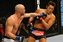 LAS VEGAS, NV - DECEMBER 30:  Sean Pierson (left) punches Dong Hyun Kim (right) during the UFC 141 event at the MGM Grand Garden Arena on December 30, 2011 in Las Vegas, Nevada.  (Photo by Donald Miralle/Zuffa LLC/Zuffa LLC via Getty Images) *** Local Caption *** Sean Pierson; Dong Hyun Kim
