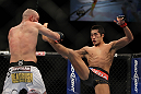 LAS VEGAS, NV - DECEMBER 30:  Dong Hyun Kim (black shorts) throws a kick at Sean Pierson (white shorts) during the UFC 141 event at the MGM Grand Garden Arena on December 30, 2011 in Las Vegas, Nevada.  (Photo by Josh Hedges/Zuffa LLC/Zuffa LLC via Getty Images) *** Local Caption *** Dong Hyun Kim; Sean Pierson