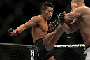 LAS VEGAS, NV - DECEMBER 30:  Dong Hyun Kim (black shorts) kicks Sean Pierson during the UFC 141 event at the MGM Grand Garden Arena on December 30, 2011 in Las Vegas, Nevada.  (Photo by Josh Hedges/Zuffa LLC/Zuffa LLC via Getty Images) *** Local Caption *** Dong Hyun Kim; Sean Pierson