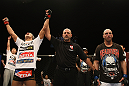 LAS VEGAS, NV - DECEMBER 30:  Dong Hyun Kim (left) is declared the winner in his fight against Sean Pierson (right) during the UFC 141 event at the MGM Grand Garden Arena on December 30, 2011 in Las Vegas, Nevada.  (Photo by Donald Miralle/Zuffa LLC/Zuffa LLC via Getty Images) *** Local Caption *** Dong Hyun Kim; Sean Pierson