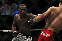 LAS VEGAS, NV - DECEMBER 30:  Anthony Njokuani (left) punches Danny Castillo (right) during the UFC 141 event at the MGM Grand Garden Arena on December 30, 2011 in Las Vegas, Nevada.  (Photo by Josh Hedges/Zuffa LLC/Zuffa LLC via Getty Images) *** Local Caption *** Anthony Njokuani; Danny Castillo