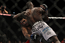 LAS VEGAS, NV - DECEMBER 30:  Anthony Njokuani (white shorts) attempts to defend a takedown from opponent Danny Castillo during the UFC 141 event at the MGM Grand Garden Arena on December 30, 2011 in Las Vegas, Nevada.  (Photo by Josh Hedges/Zuffa LLC/Zuffa LLC via Getty Images) *** Local Caption *** Danny Castillo; Anthony Njokuani