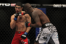 LAS VEGAS, NV - DECEMBER 30:  Anthony Njokuani (right) punches Danny Castillo (left) during the UFC 141 event at the MGM Grand Garden Arena on December 30, 2011 in Las Vegas, Nevada.  (Photo by Josh Hedges/Zuffa LLC/Zuffa LLC via Getty Images) *** Local Caption *** Anthony Njokuani; Danny Castillo