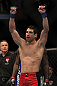 LAS VEGAS, NV - DECEMBER 30:  Danny Castillo raises his hands after his fight with Anthony Njokuani during the UFC 141 event at the MGM Grand Garden Arena on December 30, 2011 in Las Vegas, Nevada.  (Photo by Josh Hedges/Zuffa LLC/Zuffa LLC via Getty Images) *** Local Caption *** Danny Castillo