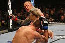 LAS VEGAS, NV - DECEMBER 30:  Ross Pearson (top) kicks Junior Assuncao during the UFC 141 event at the MGM Grand Garden Arena on December 30, 2011 in Las Vegas, Nevada.  (Photo by Donald Miralle/Zuffa LLC/Zuffa LLC via Getty Images) *** Local Caption *** Ross Pearson; Junior Assuncao