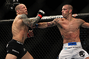 LAS VEGAS, NV - DECEMBER 30:  Junior Assuncao (white shorts) punches Ross Pearson (black shorts) during the UFC 141 event at the MGM Grand Garden Arena on December 30, 2011 in Las Vegas, Nevada.  (Photo by Josh Hedges/Zuffa LLC/Zuffa LLC via Getty Images) *** Local Caption *** Junior Assuncao; Ross Pearson