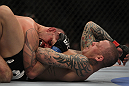 LAS VEGAS, NV - DECEMBER 30:  Ross Pearson (right) throws elbows at Junior Assuncao (left) during the UFC 141 event at the MGM Grand Garden Arena on December 30, 2011 in Las Vegas, Nevada.  (Photo by Josh Hedges/Zuffa LLC/Zuffa LLC via Getty Images) *** Local Caption *** Ross Pearson; Junior Assuncao