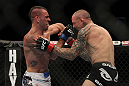 LAS VEGAS, NV - DECEMBER 30:  Junior Assuncao (left) hits Ross Pearson (right) during the UFC 141 event at the MGM Grand Garden Arena on December 30, 2011 in Las Vegas, Nevada.  (Photo by Josh Hedges/Zuffa LLC/Zuffa LLC via Getty Images) *** Local Caption *** Junior Assuncao; Ross Pearson