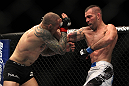 LAS VEGAS, NV - DECEMBER 30:  Junior Assuncao (right) punches Ross Pearson during the UFC 141 event at the MGM Grand Garden Arena on December 30, 2011 in Las Vegas, Nevada.  (Photo by Josh Hedges/Zuffa LLC/Zuffa LLC via Getty Images) *** Local Caption *** Junior Assuncao; Ross Pearson