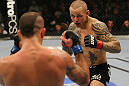 LAS VEGAS, NV - DECEMBER 30:  Ross Pearson (black shorts) and Junior Assuncao square off during the UFC 141 event at the MGM Grand Garden Arena on December 30, 2011 in Las Vegas, Nevada.  (Photo by Donald Miralle/Zuffa LLC/Zuffa LLC via Getty Images) *** Local Caption *** Ross Pearson; Junior Assuncao