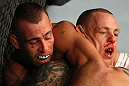 LAS VEGAS, NV - DECEMBER 30:  Junior Assuncao (left) and Ross Pearson (right) grapple for position during the UFC 141 event at the MGM Grand Garden Arena on December 30, 2011 in Las Vegas, Nevada.  (Photo by Donald Miralle/Zuffa LLC/Zuffa LLC via Getty Images) *** Local Caption *** Junior Assuncao; Ross Pearson