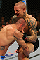 LAS VEGAS, NV - DECEMBER 30:  Ross Pearson (right) blocks a takedown attempt from Junior Assuncao during the UFC 141 event at the MGM Grand Garden Arena on December 30, 2011 in Las Vegas, Nevada.  (Photo by Donald Miralle/Zuffa LLC/Zuffa LLC via Getty Images) *** Local Caption *** Ross Pearson; Junior Assuncao