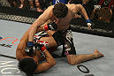 LAS VEGAS, NV - DECEMBER 30:  Jimy Hettes (top) punches Nam Phan during the UFC 141 event at the MGM Grand Garden Arena on December 30, 2011 in Las Vegas, Nevada.  (Photo by Donald Miralle/Zuffa LLC/Zuffa LLC via Getty Images) *** Local Caption *** Jimy Hettes; Nam Phan