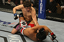 LAS VEGAS, NV - DECEMBER 30:  Jimy Hettes (top) punches Nam Phan during the UFC 141 event at the MGM Grand Garden Arena on December 30, 2011 in Las Vegas, Nevada.  (Photo by Donald Miralle/Zuffa LLC/Zuffa LLC via Getty Images) *** Local Caption *** Jimy Hettes; Nam Phan
