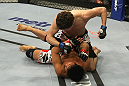LAS VEGAS, NV - DECEMBER 30:  Jimy Hettes (top) punches Nam Phan during the UFC 141 event at the MGM Grand Garden Arena on December 30, 2011 in Las Vegas, Nevada.  (Photo by Donald Miralle/Zuffa LLC/Zuffa LLC via Getty Images) *** Local Caption *** Jimy Hettes; Nam Phan