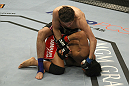 LAS VEGAS, NV - DECEMBER 30:  Jimy Hettes (top) punches Nam Phan during the UFC 141 event at the MGM Grand Garden Arena on December 30, 2011 in Las Vegas, Nevada.  (Photo by Donald Miralle/Zuffa LLC/Zuffa LLC via Getty Images) *** Local Caption *** Jimy Hettes; Nam Phan