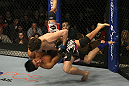 LAS VEGAS, NV - DECEMBER 30:  Jimy Hettes (black shorts) slams Nam Phan during the UFC 141 event at the MGM Grand Garden Arena on December 30, 2011 in Las Vegas, Nevada.  (Photo by Donald Miralle/Zuffa LLC/Zuffa LLC via Getty Images) *** Local Caption *** Jimy Hettes; Nam Phan