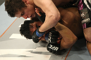 LAS VEGAS, NV - DECEMBER 30:  Jimy Hettes (top) punches Nam Phan during the UFC 141 event at the MGM Grand Garden Arena on December 30, 2011 in Las Vegas, Nevada.  (Photo by Donald Miralle/Zuffa LLC/Zuffa LLC via Getty Images) *** Local Caption *** Jimy Hettes; Nam Phan