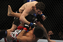 LAS VEGAS, NV - DECEMBER 30:  Jimy Hettes (top) punches Nam Phan during the UFC 141 event at the MGM Grand Garden Arena on December 30, 2011 in Las Vegas, Nevada.  (Photo by Josh Hedges/Zuffa LLC/Zuffa LLC via Getty Images) *** Local Caption *** Jimy Hettes; Nam Phan