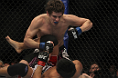LAS VEGAS, NV - DECEMBER 30:  Jimy Hettes (top) punches Nam Phan during the UFC 141 event at the MGM Grand Garden Arena on December 30, 2011 in Las Vegas, Nevada.  (Photo by Josh Hedges/Zuffa LLC/Zuffa LLC via Getty Images) *** Local Caption *** Jimy Hettes; Nam Phan
