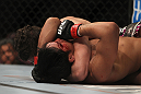 LAS VEGAS, NV - DECEMBER 30:  Jimy Hettes (left) attempts to submit Nam Phan during the UFC 141 event at the MGM Grand Garden Arena on December 30, 2011 in Las Vegas, Nevada.  (Photo by Josh Hedges/Zuffa LLC/Zuffa LLC via Getty Images) *** Local Caption *** Jimy Hettes; Nam Phan