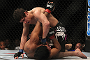 LAS VEGAS, NV - DECEMBER 30:  Jimy Hettes (top) punches Nam Phan during the UFC 141 event at the MGM Grand Garden Arena on December 30, 2011 in Las Vegas, Nevada.  (Photo by Josh Hedges/Zuffa LLC/Zuffa LLC via Getty Images) *** Local Caption *** Jimy Hettes; Nam Phan