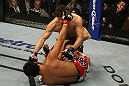 LAS VEGAS, NV - DECEMBER 30:  Jimy Hettes (top) punches Nam Phan during the UFC 141 event at the MGM Grand Garden Arena on December 30, 2011 in Las Vegas, Nevada.  (Photo by Donald Miralle/Zuffa LLC/Zuffa LLC via Getty Images) *** Local Caption *** Jimy Hettes; Nam Phan