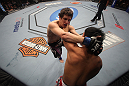 LAS VEGAS, NV - DECEMBER 30:  Jimy Hettes (left) and Nam Phan grapple for position during the UFC 141 event at the MGM Grand Garden Arena on December 30, 2011 in Las Vegas, Nevada.  (Photo by Donald Miralle/Zuffa LLC/Zuffa LLC via Getty Images) *** Local Caption *** Jimy Hettes; Nam Phan