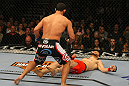 LAS VEGAS, NV - DECEMBER 30:  Johny Hendricks (black shorts) follows Jon Fitch after a knockout blow during the UFC 141 event at the MGM Grand Garden Arena on December 30, 2011 in Las Vegas, Nevada.  (Photo by Donald Miralle/Zuffa LLC/Zuffa LLC via Getty Images) *** Local Caption *** Johny Hendricks; Jon Fitch