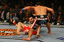 LAS VEGAS, NV - DECEMBER 30:  Johny Hendricks (black shorts) throws a punch at Jon Fitch during the UFC 141 event at the MGM Grand Garden Arena on December 30, 2011 in Las Vegas, Nevada.  (Photo by Donald Miralle/Zuffa LLC/Zuffa LLC via Getty Images) *** Local Caption *** Johny Hendricks; Jon Fitch