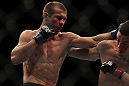 LAS VEGAS, NV - DECEMBER 30:  Donald Cerrone (left) punches Nate Diaz during the UFC 141 event at the MGM Grand Garden Arena on December 30, 2011 in Las Vegas, Nevada.  (Photo by Josh Hedges/Zuffa LLC/Zuffa LLC via Getty Images) *** Local Caption *** Donald Cerrone; Nate Diaz